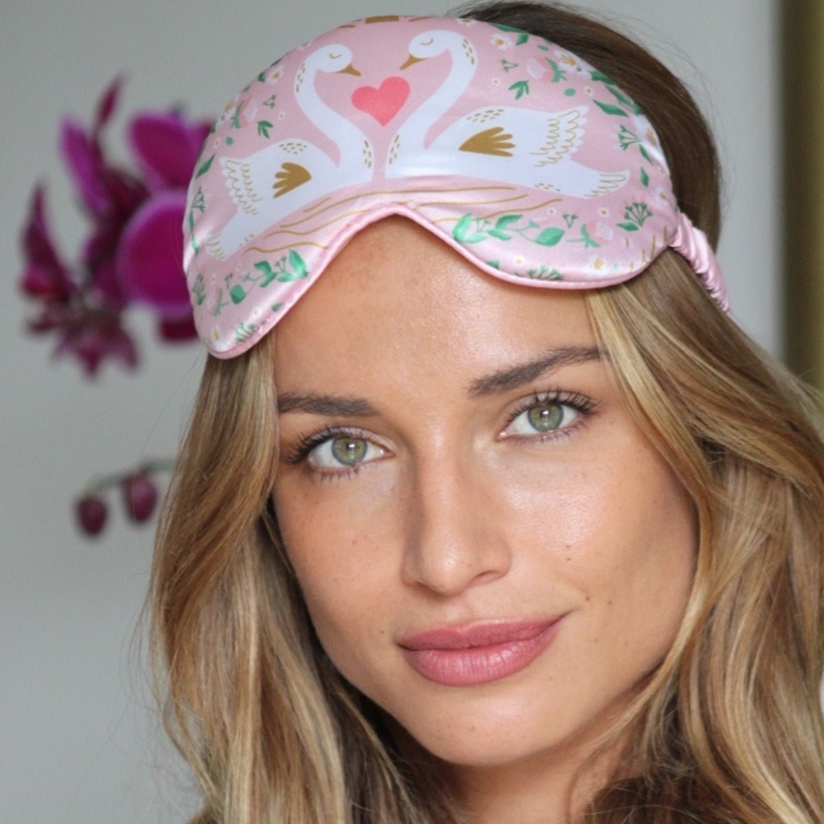 Close-up of SMUG Cloud Padded Satin Sleep Mask with swan print, showcasing its soft fabric and comfortable design for restful sleep.