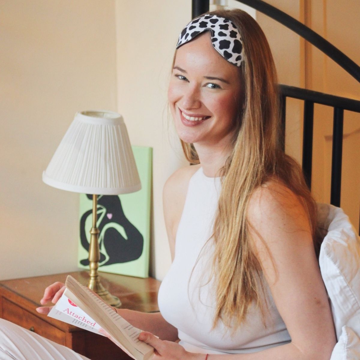 Contoured SMUG Blackout Sleep Mask with cow print design, ideal for blocking light and promoting restful sleep.