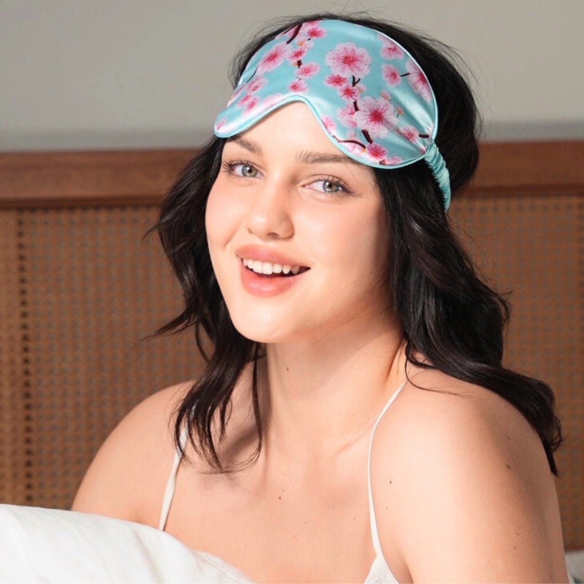 SMUG satin sleepover set with cherry blossom print, including a sleep mask and matching accessories for a comfortable night.