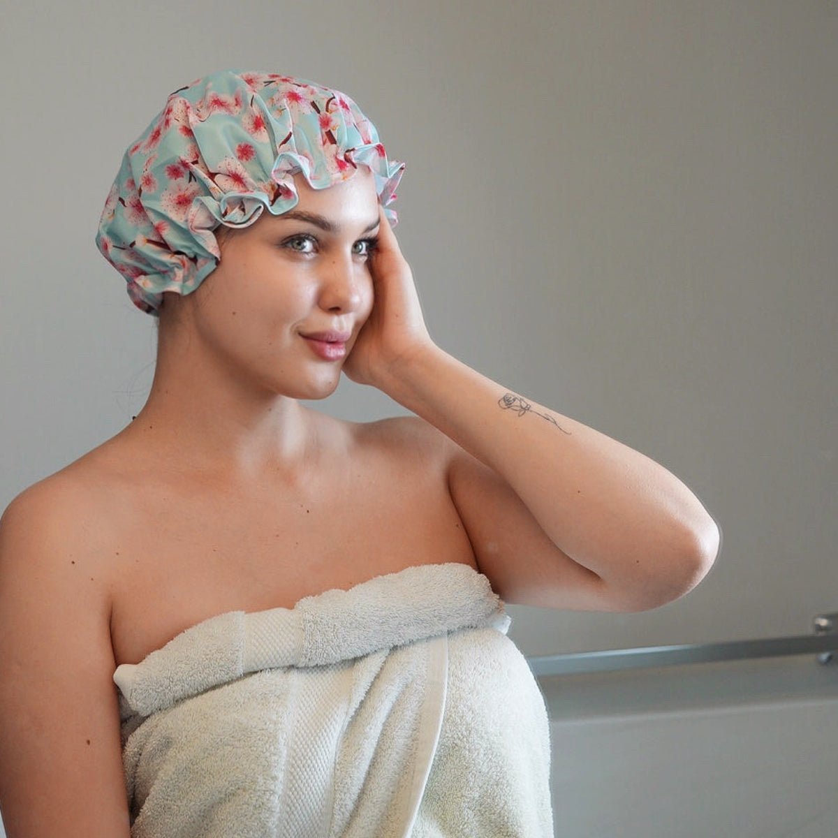 SMUG cherry blossom print shower cap with waterproof material, designed to keep hair dry during showers.