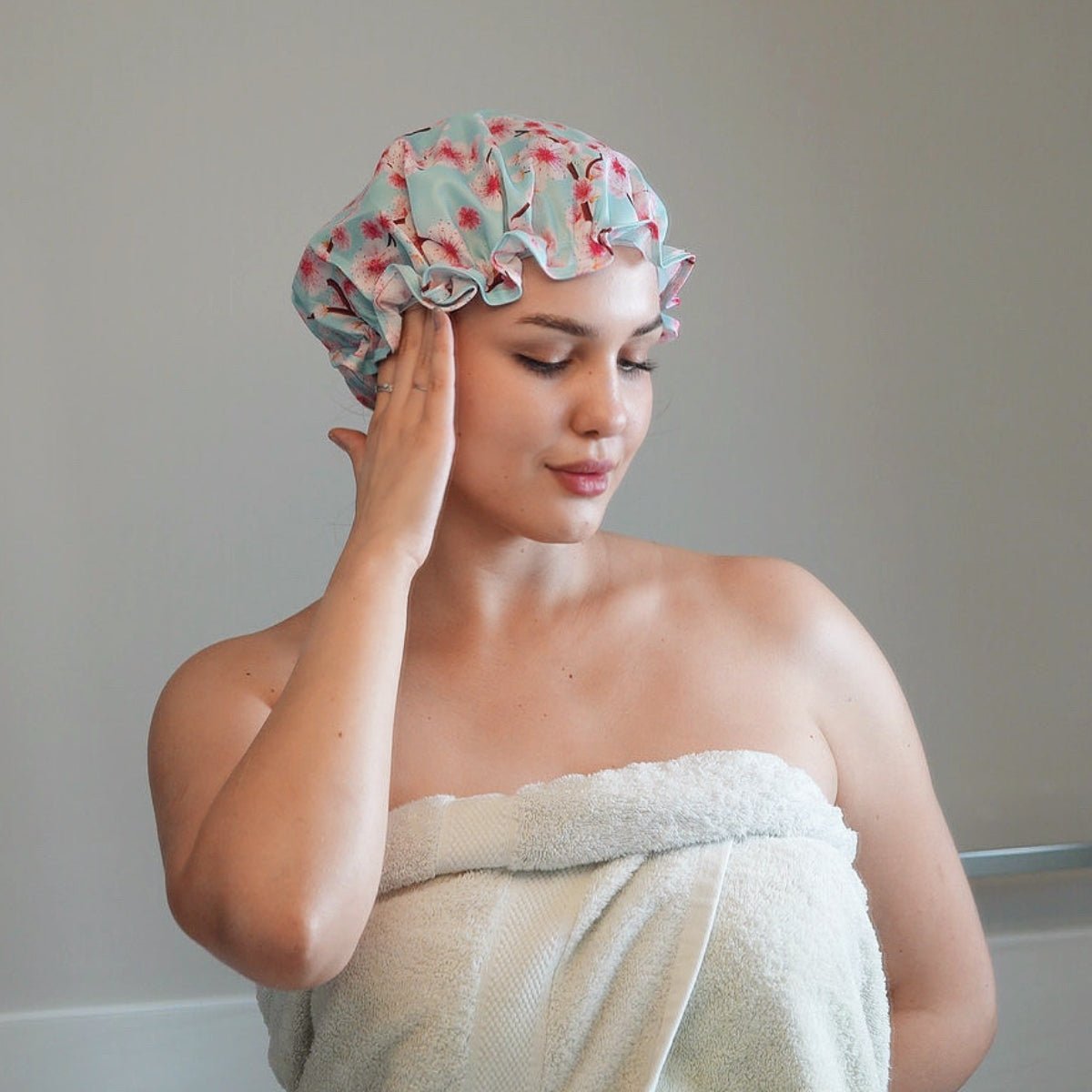 SMUG Cherry Blossom Print Shower Cap with waterproof material, featuring a delicate floral pattern for hair protection during showers.