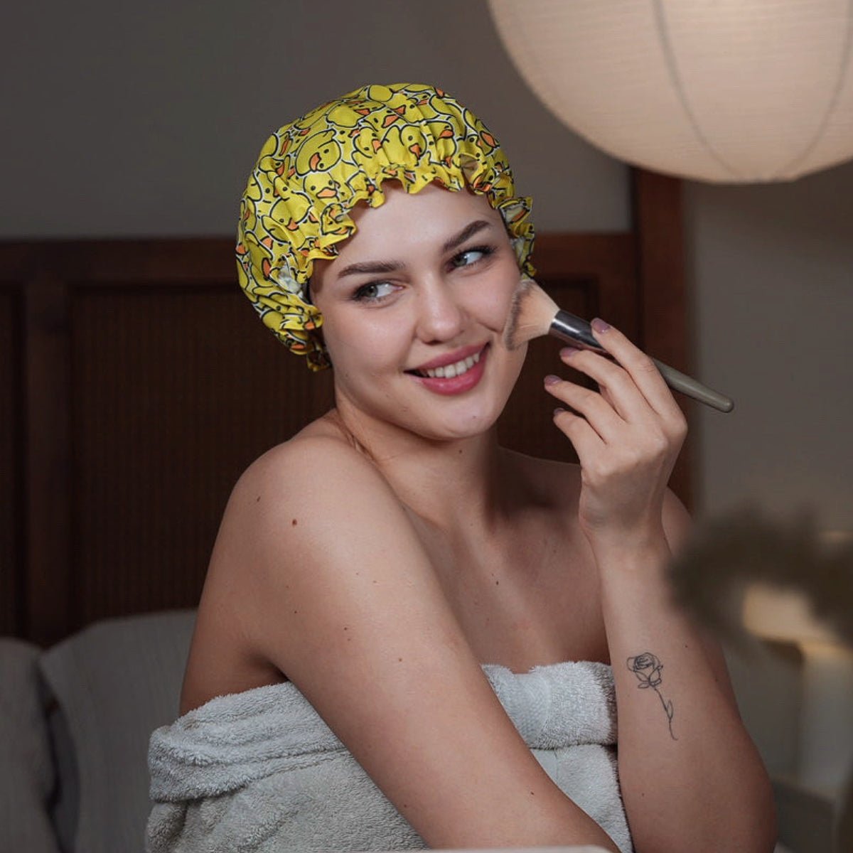 SMUG duck print shower cap with waterproof material, designed for keeping hair dry during showers.