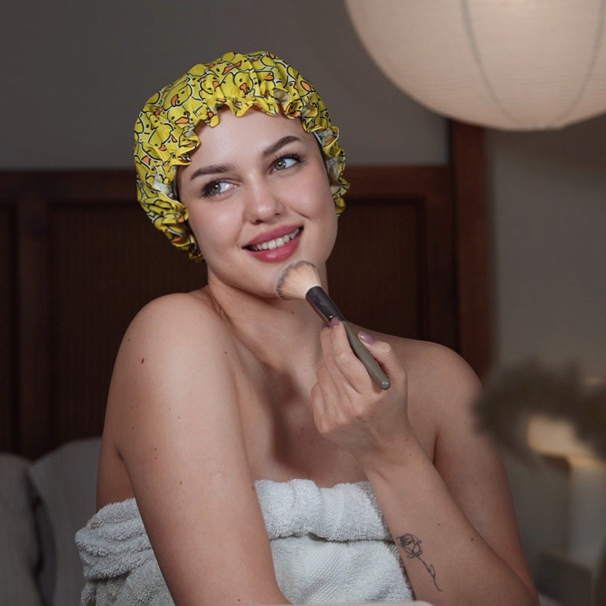 SMUG duck print shower cap with a playful yellow duck design, waterproof and ideal for protecting hair during showers.