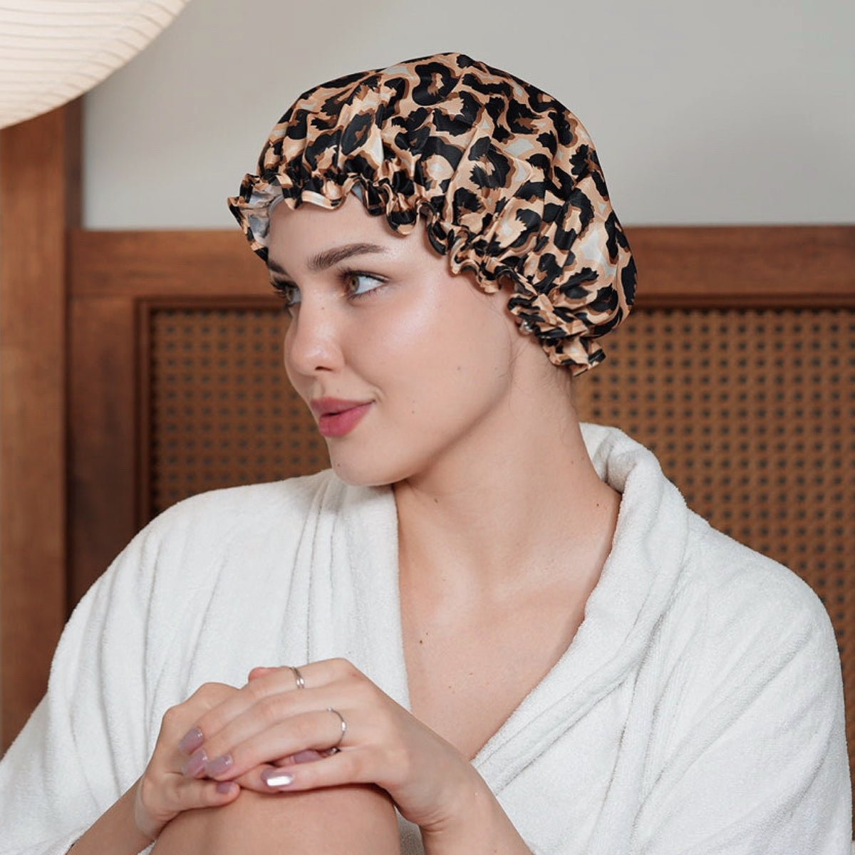 SMUG leopard print shower cap made of waterproof material, designed to keep hair dry during showers.