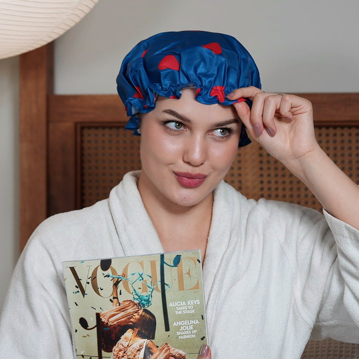 Smug loveheart print shower cap featuring a colorful, playful design perfect for protecting hair in the shower.