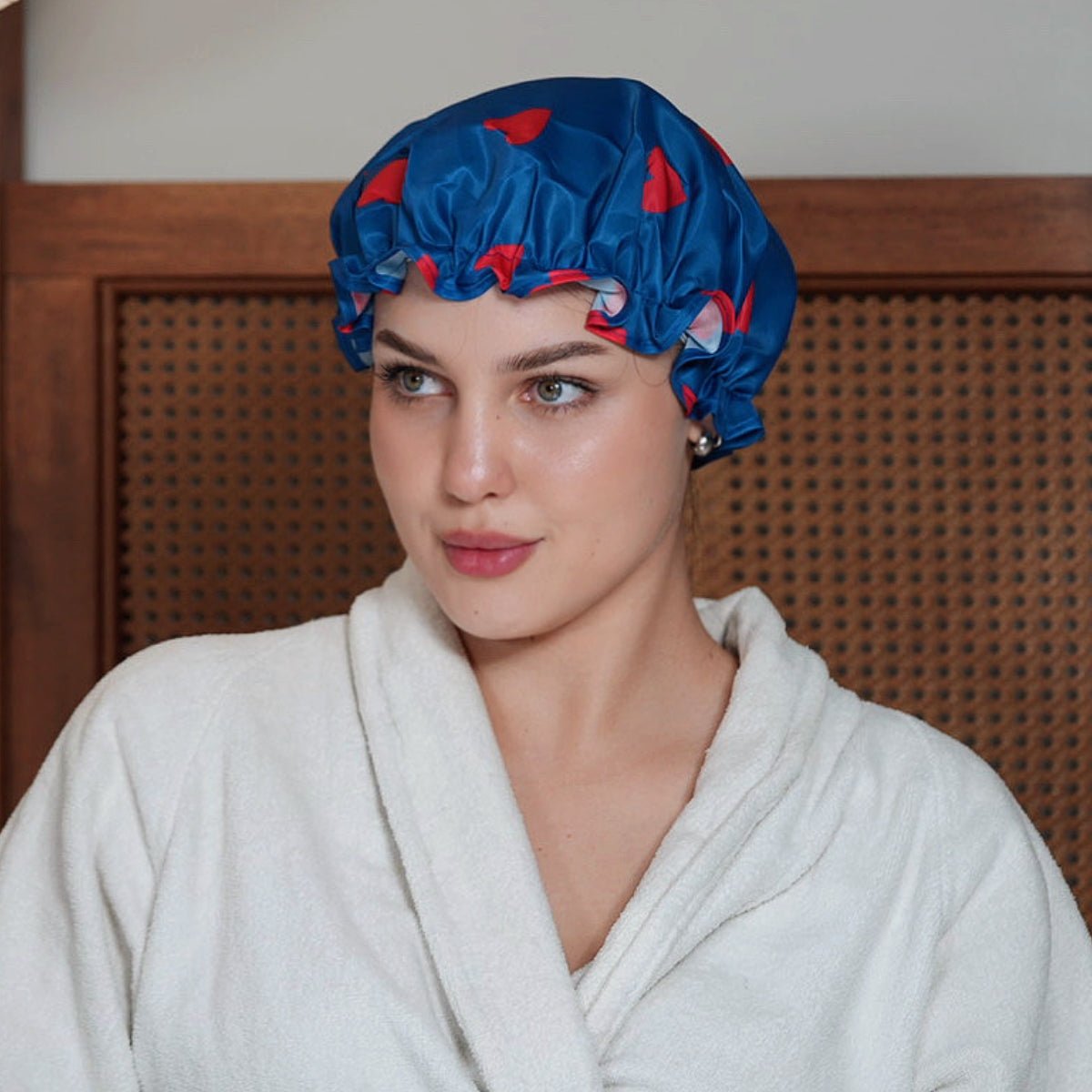 SMUG Loveheart print shower cap with waterproof material, designed for comfortable hair protection during showers.