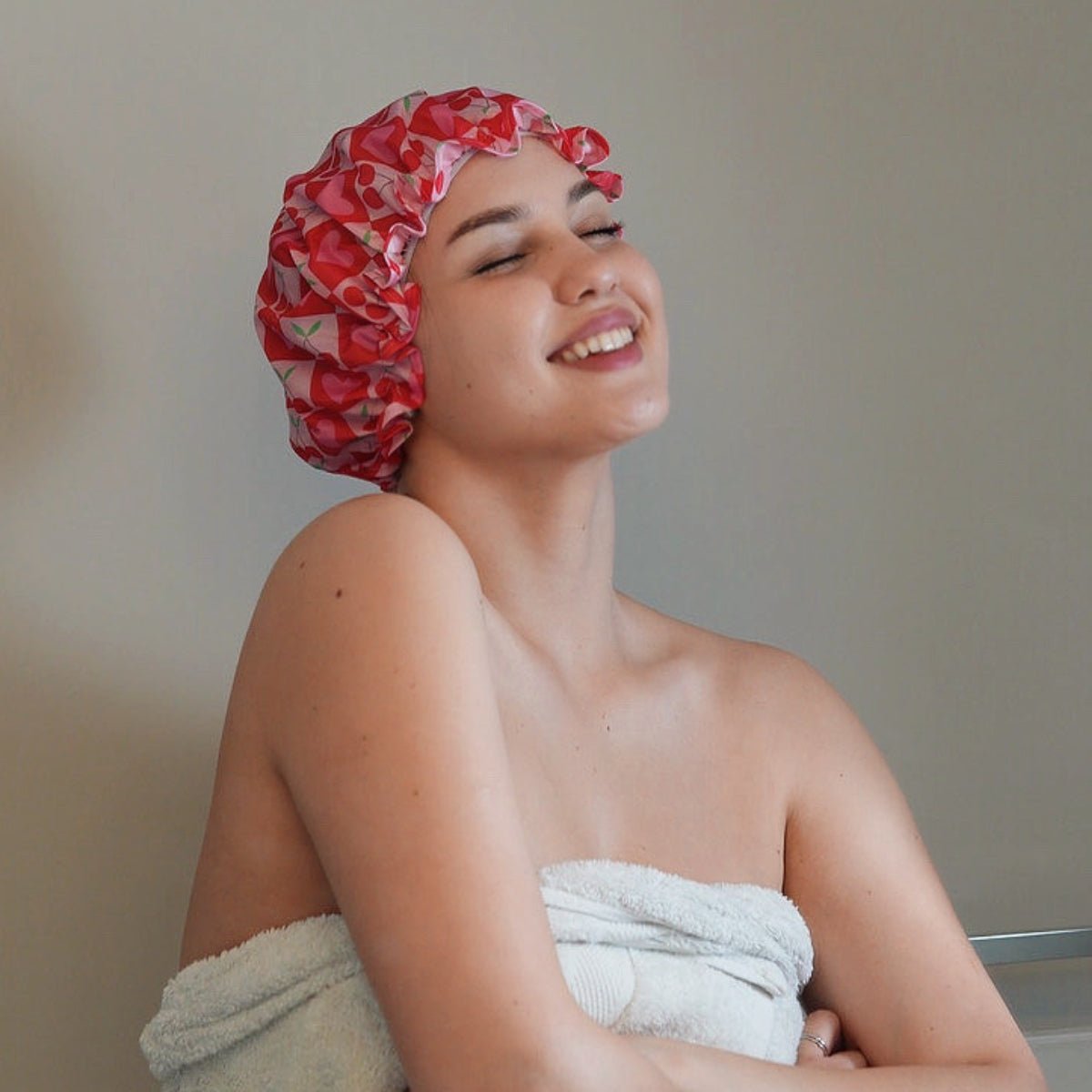 SMUG strawberry print shower cap with playful strawberry pattern, designed to keep hair dry during showers.