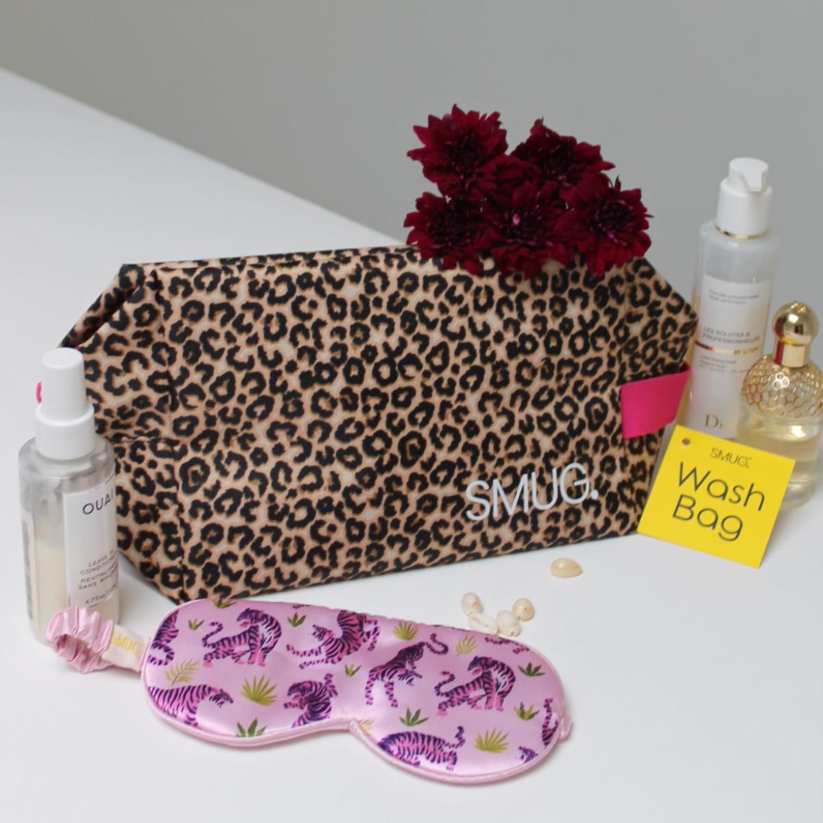 Pink satin sleep mask with leopard print from SMUG Sleepover Set, featuring animal print and satin fabric for comfortable sleep.