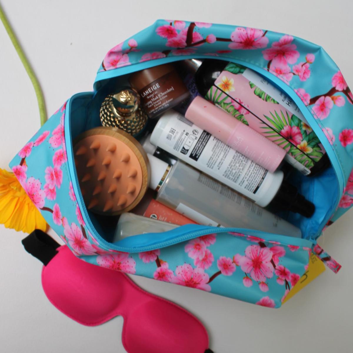 SMUG Sleepover Set with cherry blossom print includes a bright pink wash bag, contoured sleep mask, and accessories for a relaxing night.