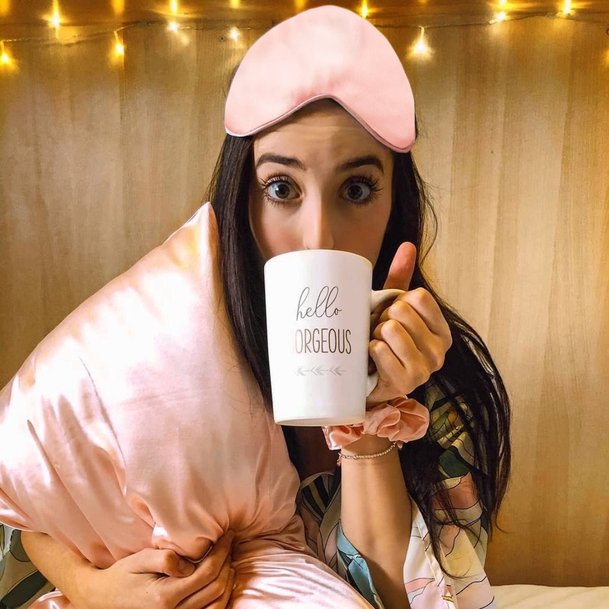 Pink satin sleep mask and pillowcase set by SMUG, featuring smooth satin fabric for a luxurious sleep experience.