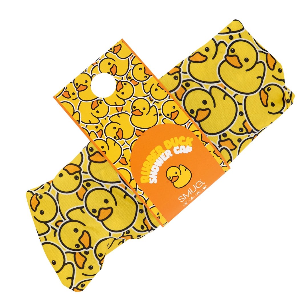 SMUG duck print shower cap showing colorful duck design in packaging, waterproof and reusable for hair protection.