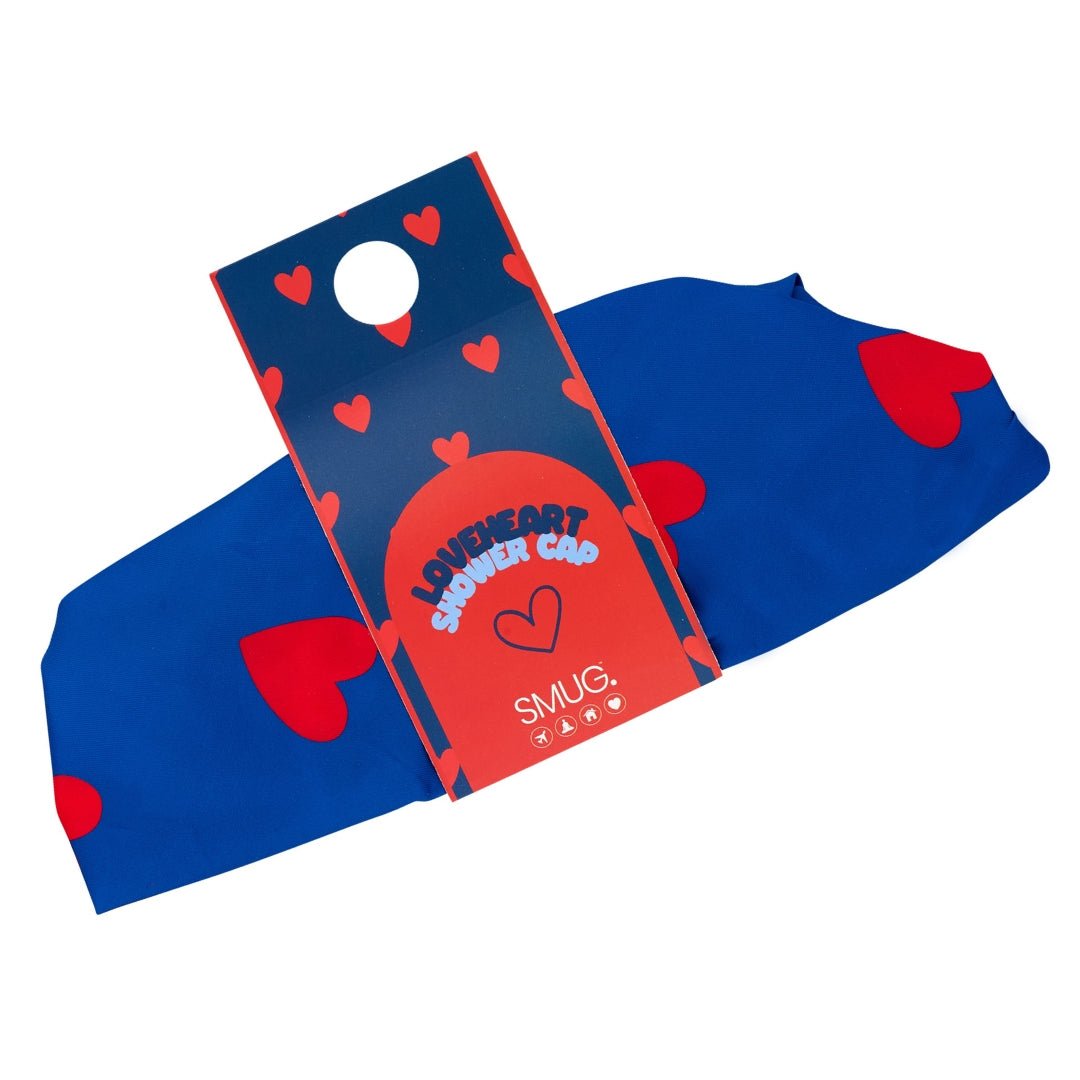 SMUG loveheart print shower cap with waterproof material in packaging, designed to keep hair dry during showering.