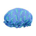 SMUG shower cap with colorful seahorse print, waterproof design, ideal for protecting hair during showers.