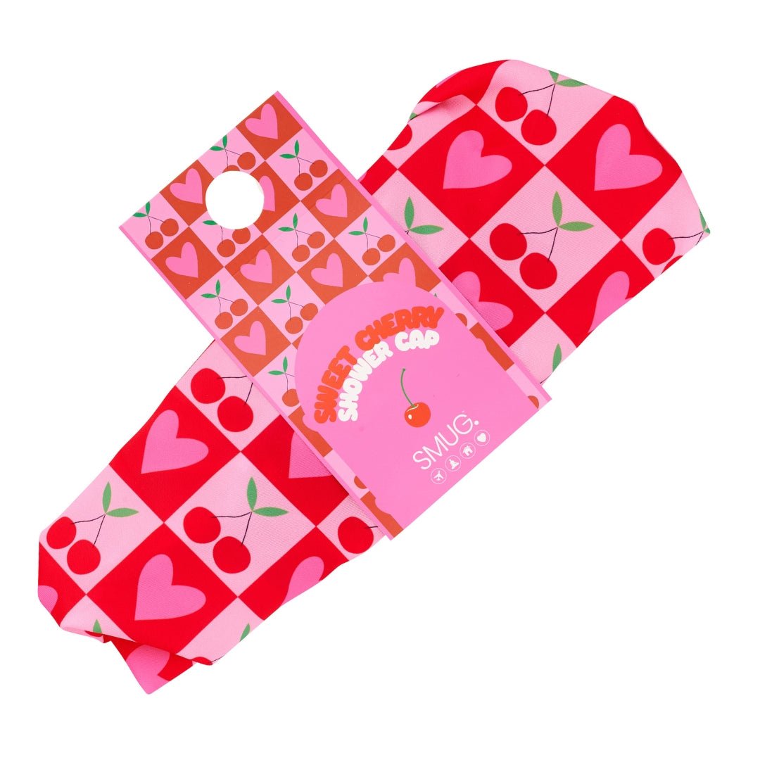 SMUG shower cap with sweet cherry print, shown in packaging, waterproof and reusable for hair protection during baths or showers.