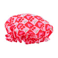 SMUG shower cap with a sweet cherry print, waterproof and reusable, ideal for protecting hair during showers.
