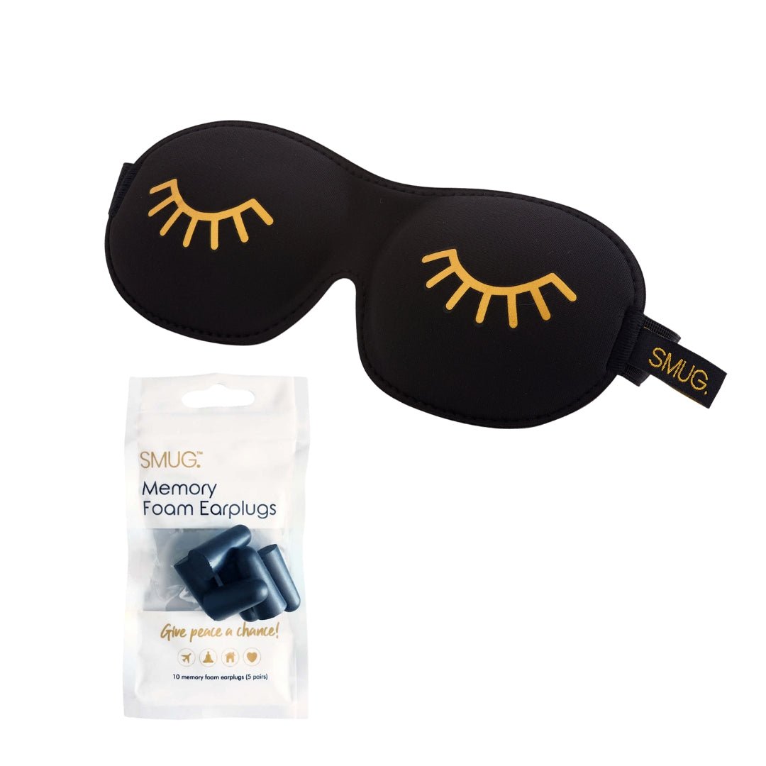 Contoured SMUG blackout sleep mask with black wink print and earplugs for comfortable, dark sleep.