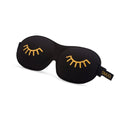 Contoured black blackout sleep mask with wink print from SMUG, designed to block light and enhance sleep comfort.