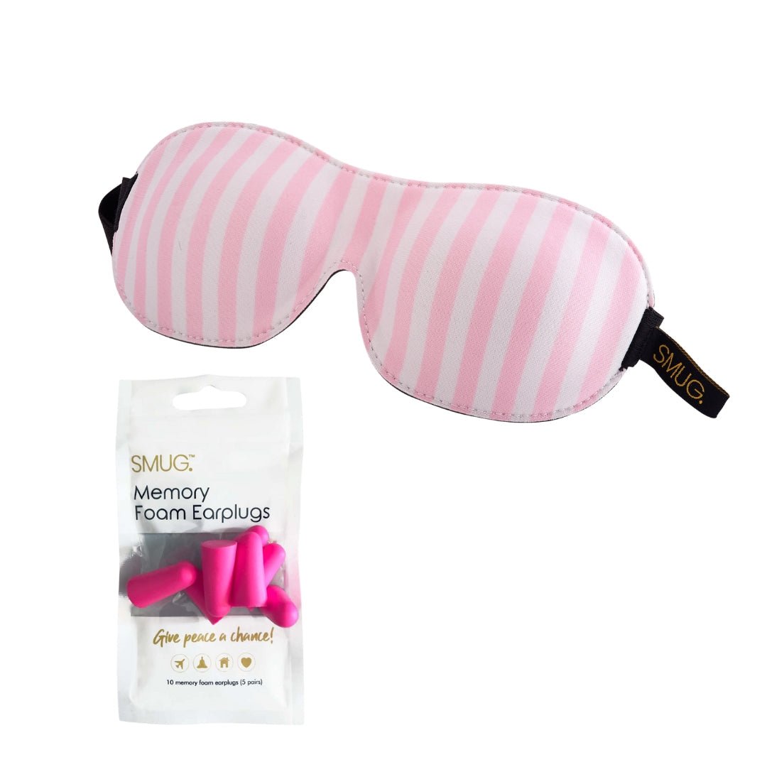 Contoured SMUG blackout sleep mask with a colorful candy shop print, designed for comfortable eye coverage and light blocking.