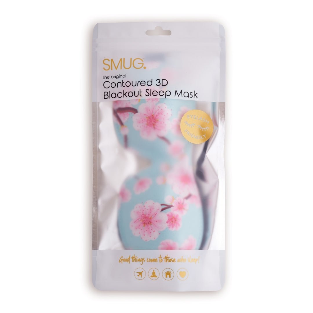 Contoured 3D black sleep mask with cherry blossom print by SMUG, designed for comfortable, full coverage sleep.