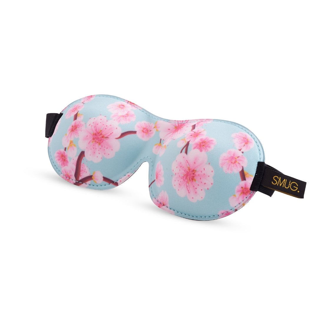 Contoured 3D Blackout Sleep Mask with cherry blossom print by SMUG, designed to block light and ensure comfortable sleep.