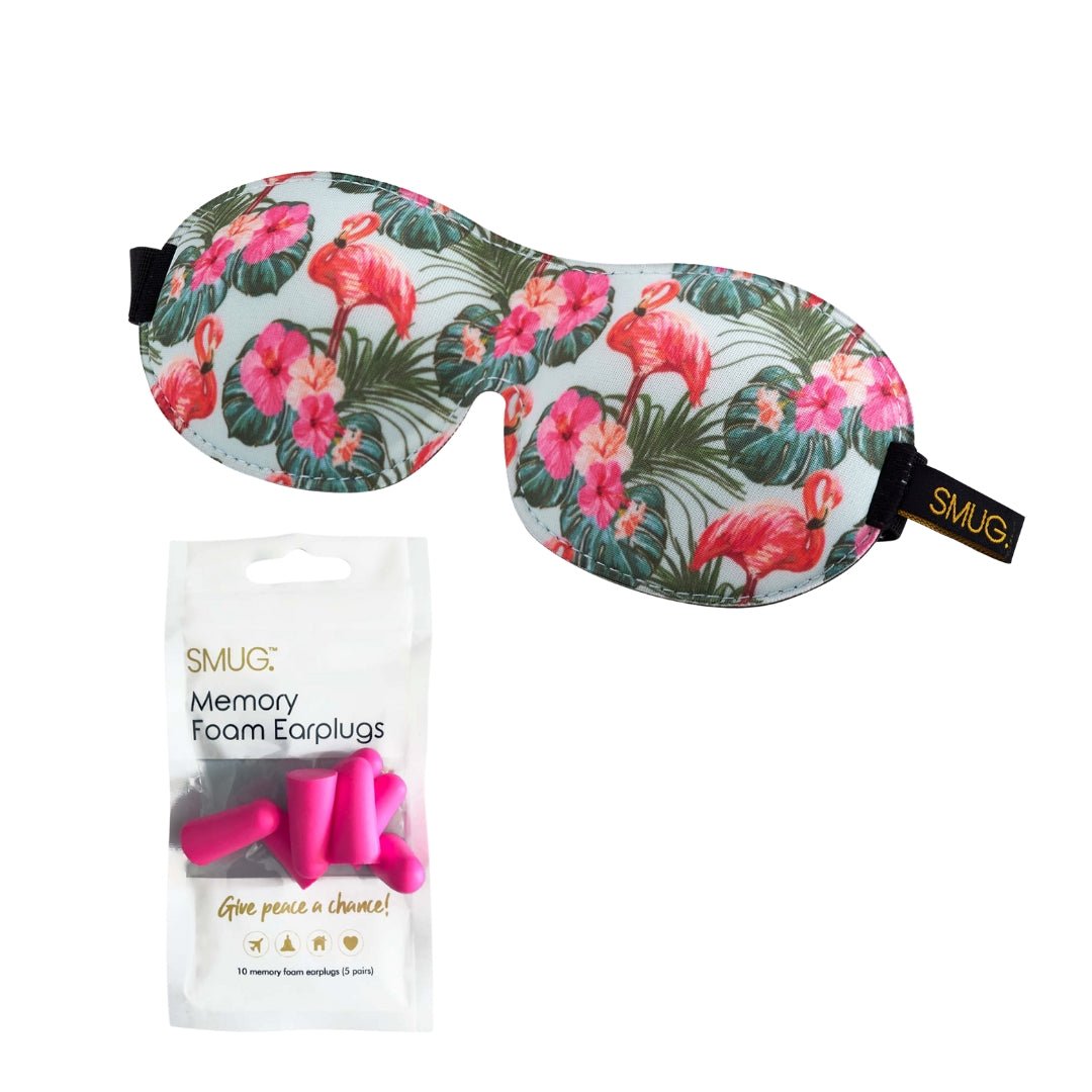 Contoured SMUG blackout sleep mask with pink flamingo print and earplugs for comfortable, dark sleep.