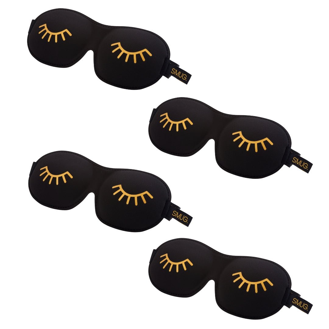 SMUG contoured sleep mask set with various designs, including a black wink mask, designed for comfortable sleep and blockout.