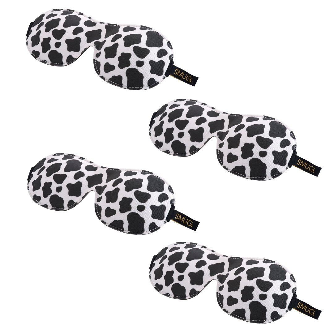 Contoured SMUG sleep mask set with cow design, multiple sleep masks, soft fabric for comfortable sleep, and adjustable fit.