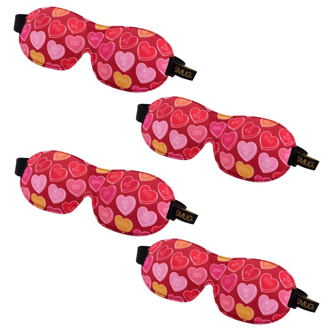 Set of SMUG contoured sleep masks with various designs, including heart and sweets patterns, for comfortable sleep.