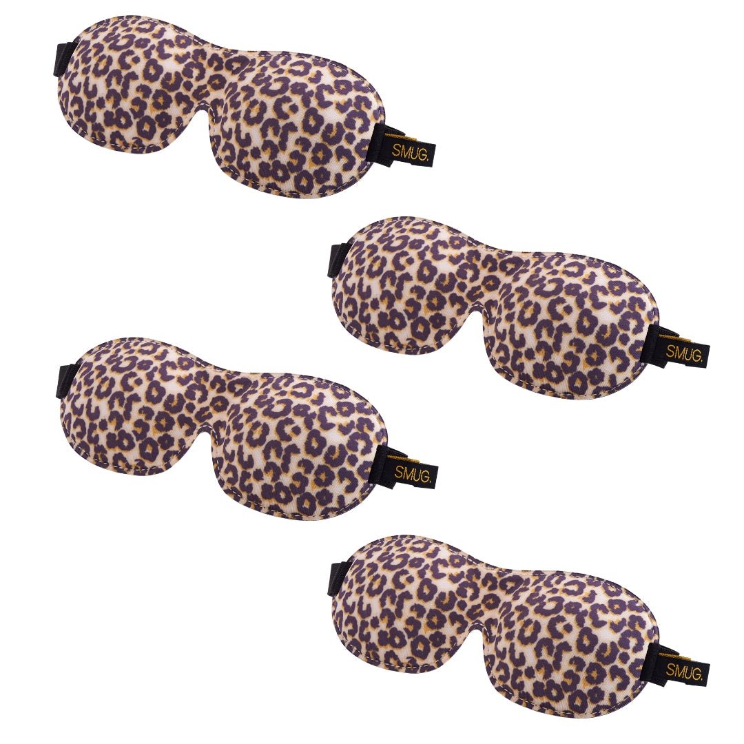 Set of SMUG contoured sleep masks in various designs, including a leopard print, designed for comfortable sleep and light blocking.