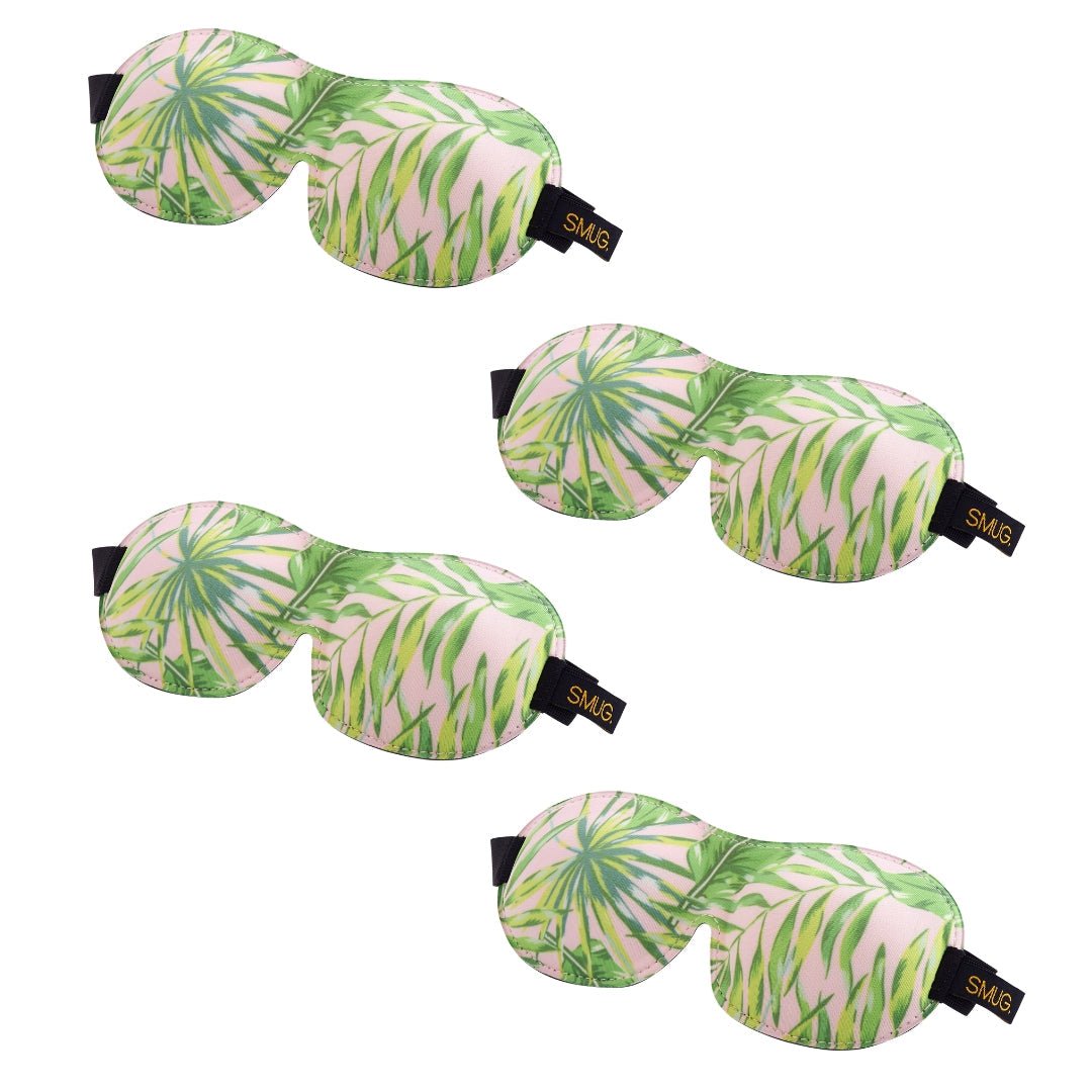 Contoured SMUG sleep mask set with various designs, including a palm pattern, for comfortable and light-blocking sleep.