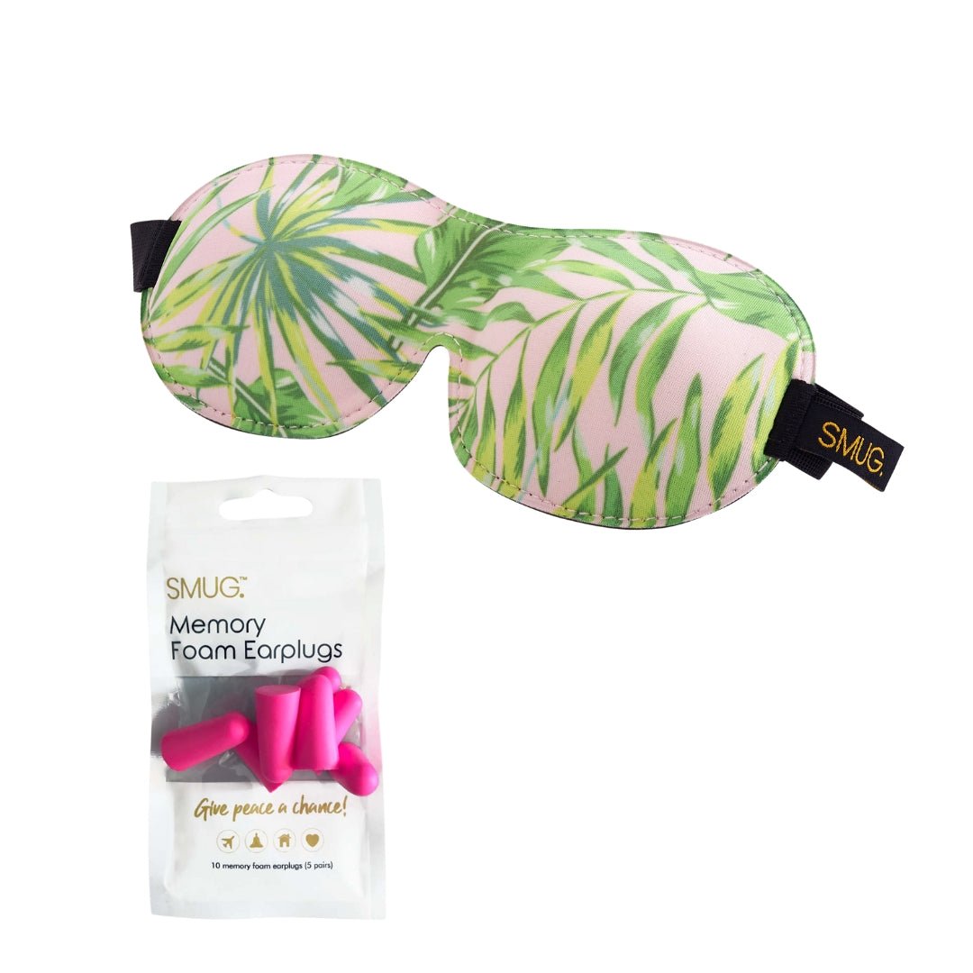 Contoured SMUG 3D black sleep mask with pink palm print, designed for blackout and comfort, includes matching earplugs.