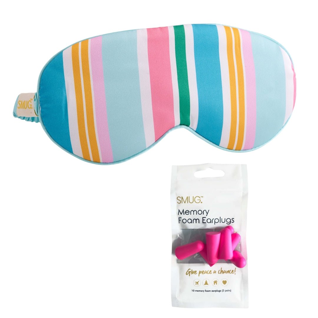 Pink satin sleep mask with bold spring stripe print from SMUG, designed for comfortable overnight sleep and relaxation.