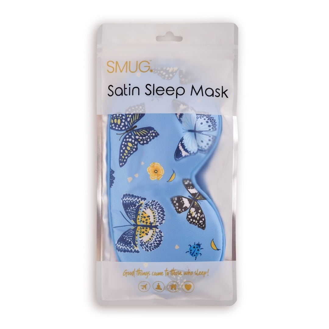 SMUG satin sleep mask with a butterflies print, featuring a smooth, shiny fabric and elastic strap for comfortable sleep.