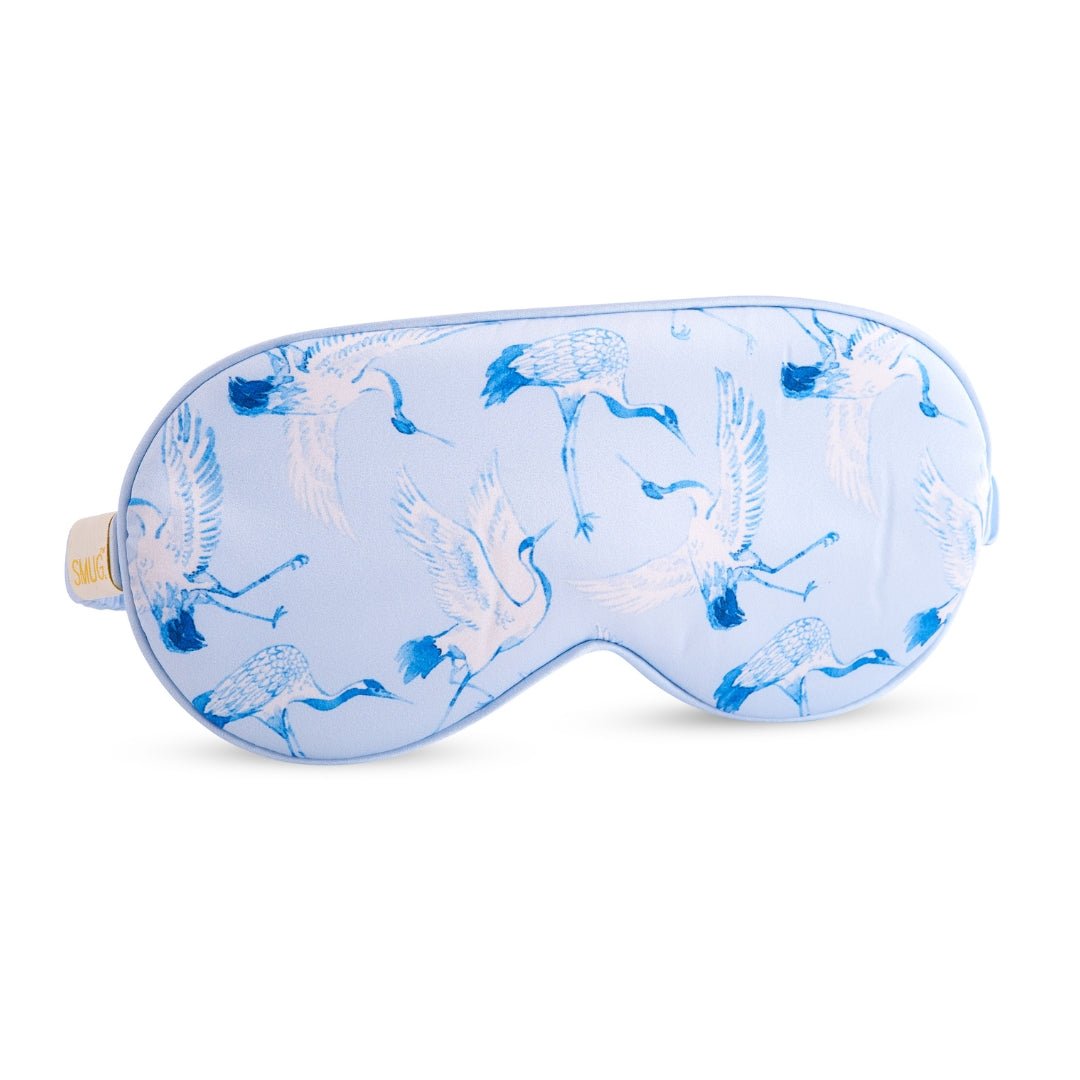 Satin sleep mask with cranes print by SMUG, soft and comfortable for restful sleep, featuring elegant crane design on smooth satin fabric.