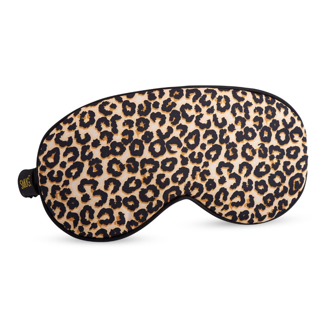 SMUG satin sleep mask in leopard print with soft, luxurious fabric for comfortable nighttime sleep.