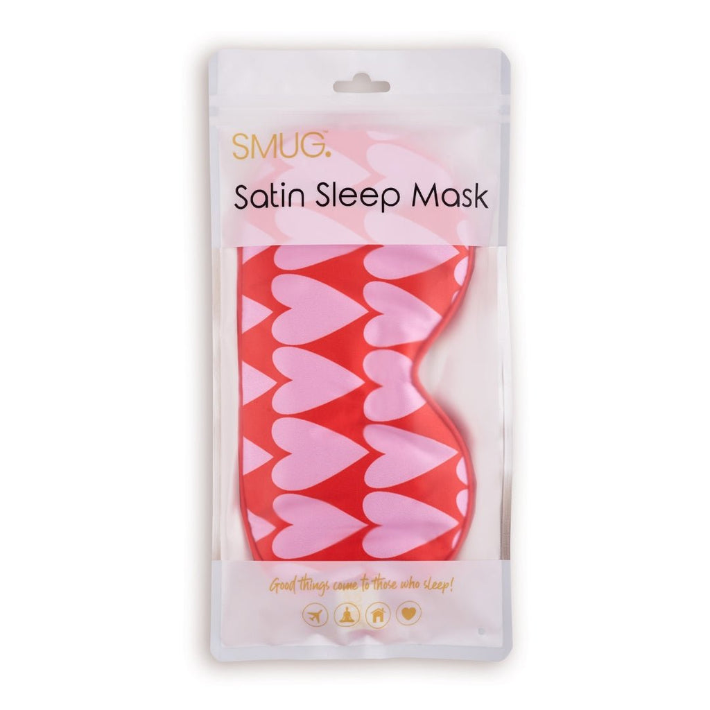 SMUG satin sleep mask with a longheart print, shown in packaging, designed for comfortable sleep and light blocking.