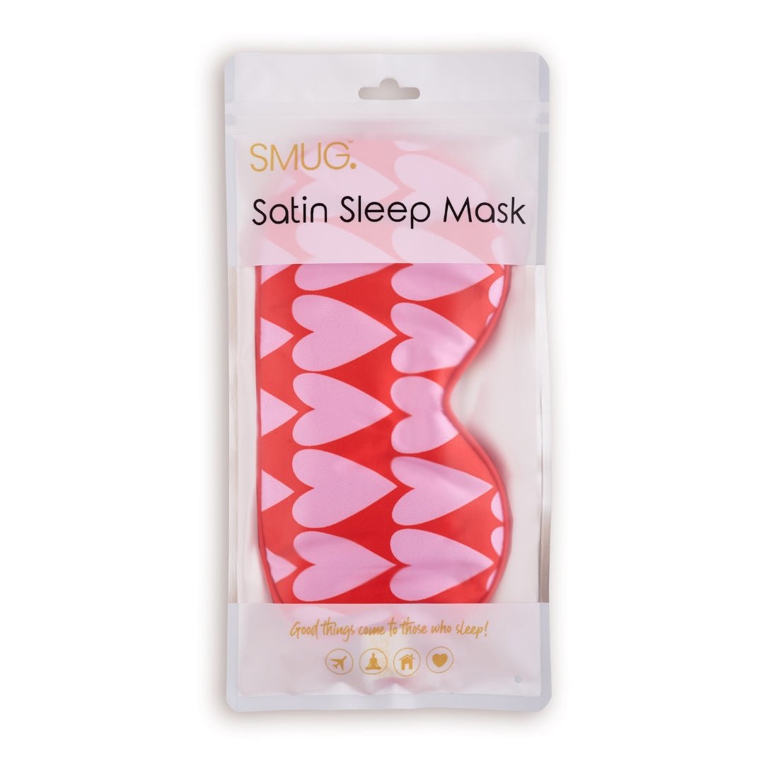 SMUG satin sleep mask with a longheart print, shown in packaging, designed for comfortable sleep and light blocking.