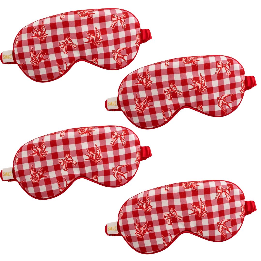 Set of SMUG satin sleep masks with gingham, bows, and bird designs in a multi-pack for restful nights and comfortable sleep.
