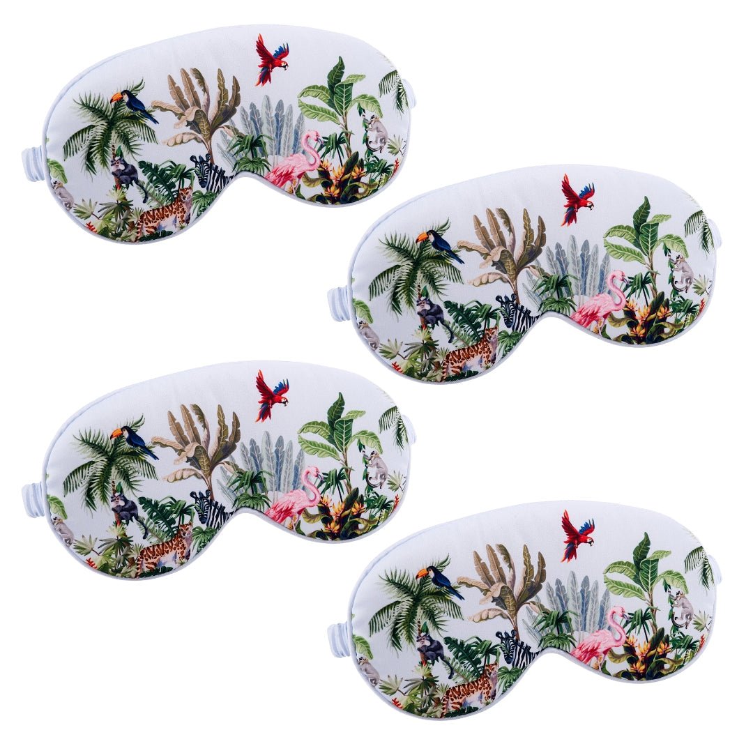 Set of satin sleep masks by SMUG in various jungle-inspired designs, soft and comfortable for restful sleep.