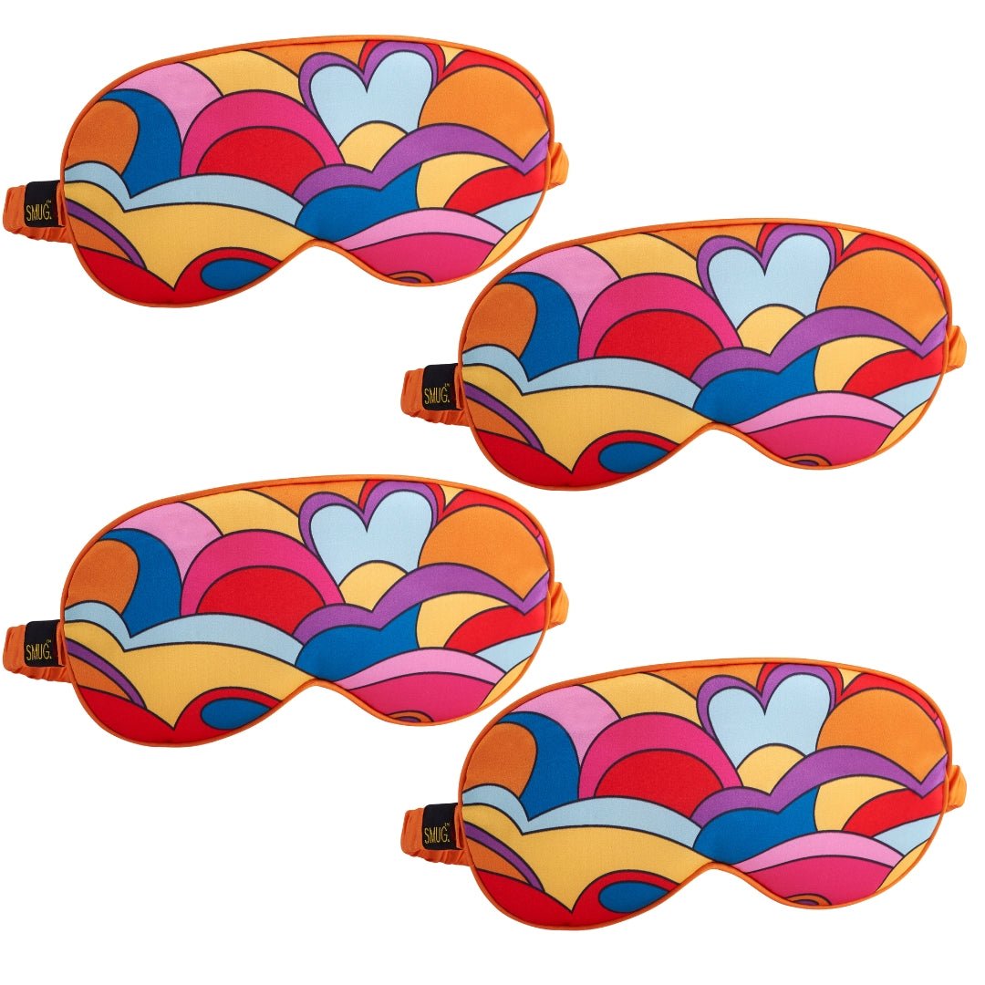 Set of SMUG satin sleep masks in various designs, including Lucy in the Sky, for comfortable and stylish nighttime wear.