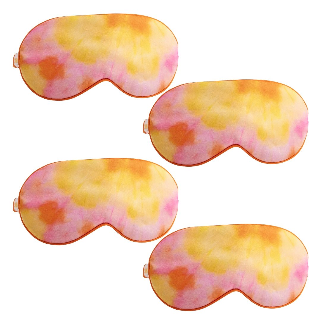 Set of SMUG satin sleep masks in vibrant orange tie-dye designs, soft and comfortable for restful sleep.