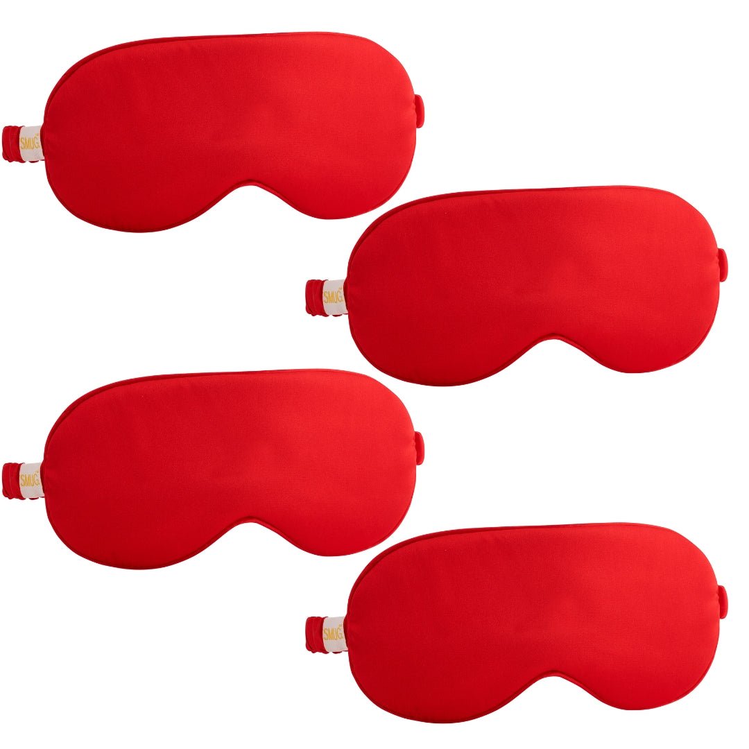 Set of multiple satin sleep masks in various designs by SMUG, featuring soft, smooth fabric for comfortable sleep.