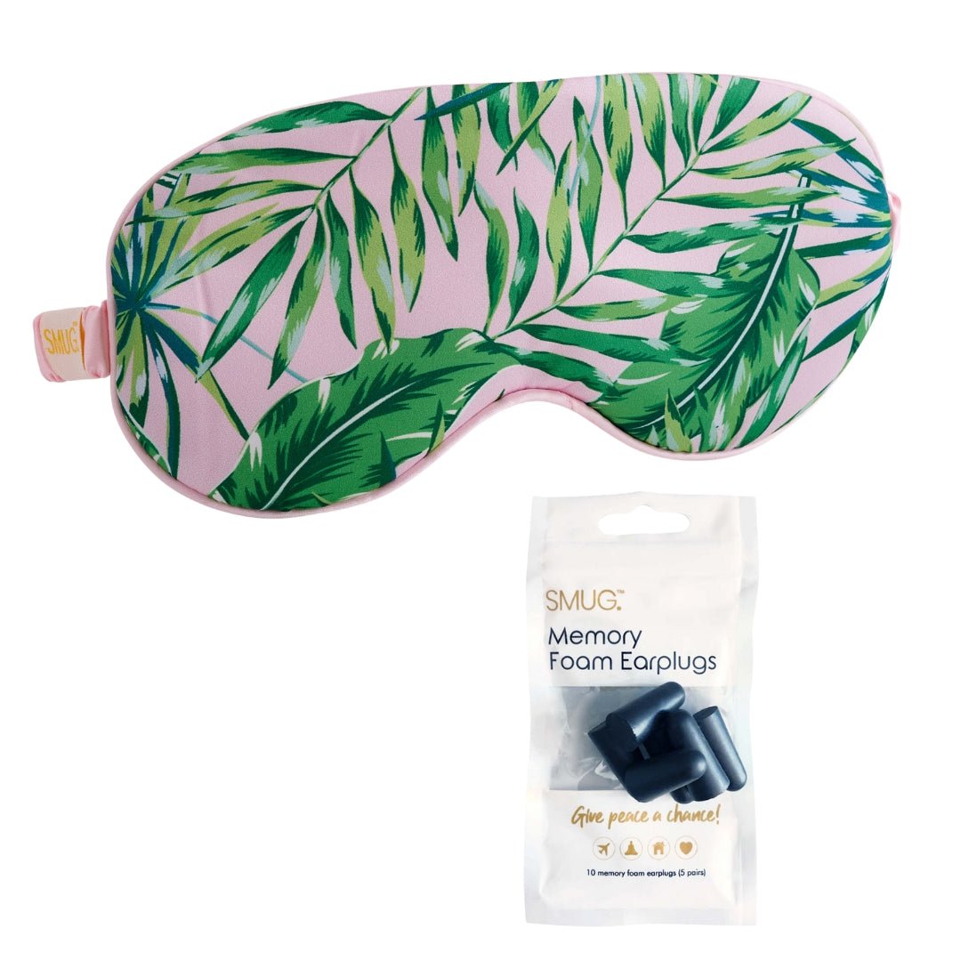 Black satin sleep mask with palm print from SMUG, featuring adjustable earplugs for comfortable overnight sleep.