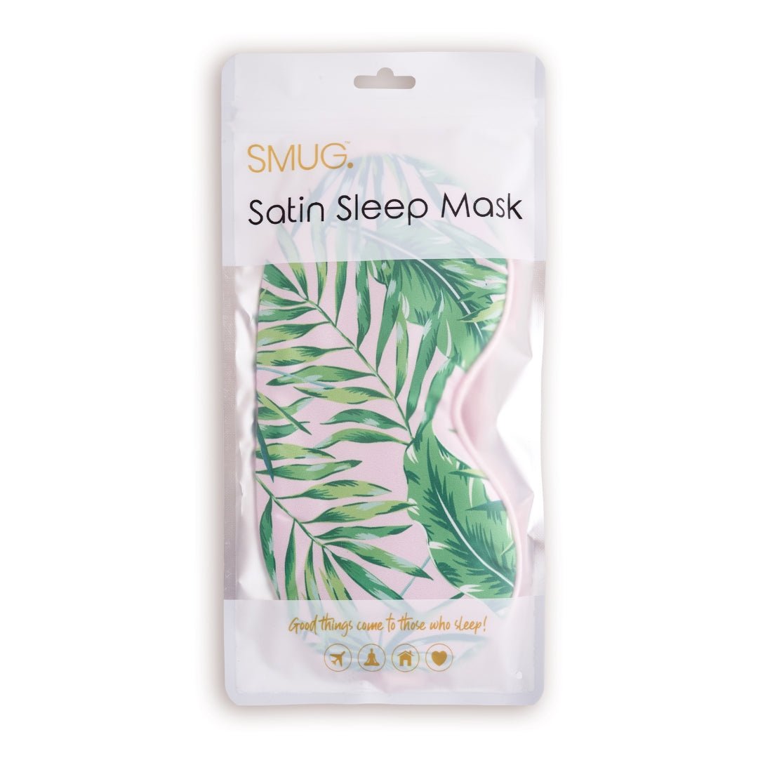 SMUG satin sleep mask with palm print, shown in packaging, comfortable and soft for restful sleep and relaxation.