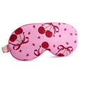 Pink satin sleep mask with cherry print by SMUG, soft and comfortable eye mask for restful sleep.