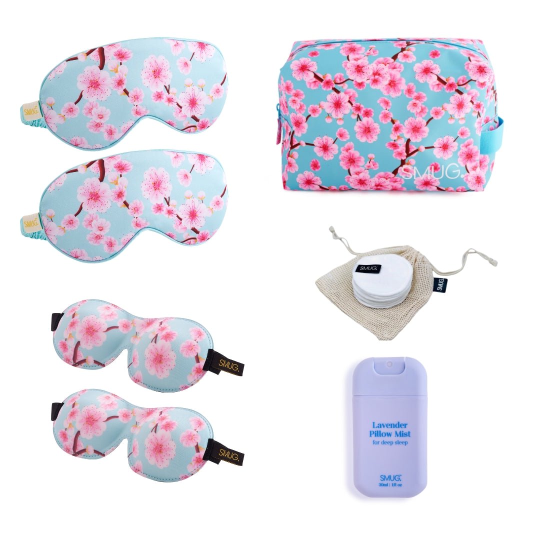 SMUG Sleepover Set with cherry blossom print, featuring pajamas and accessories for a cozy night in.