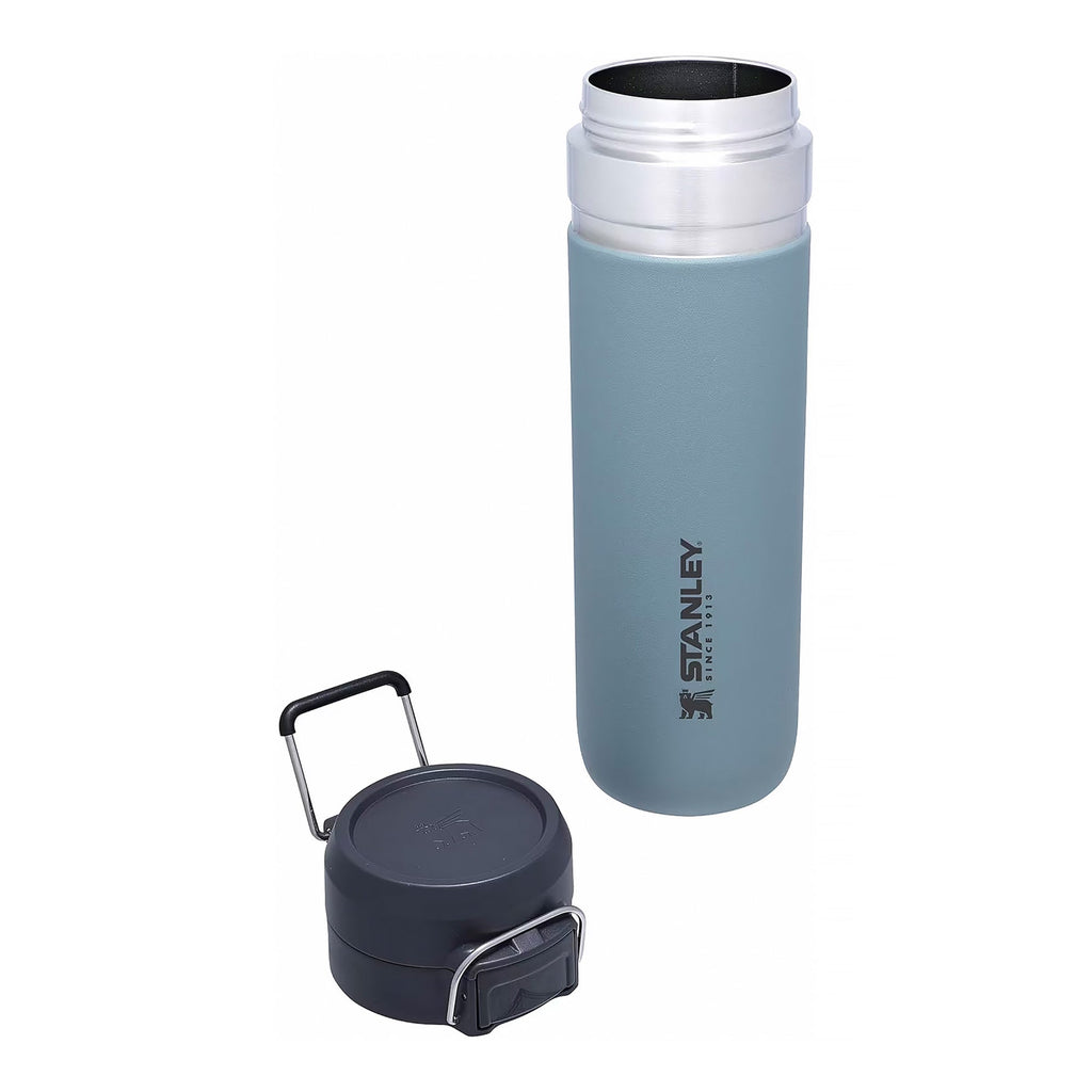 Stanley Quick Flip 0.7L water bottle in azure, with a flip-top lid and durable design for outdoor hydration.