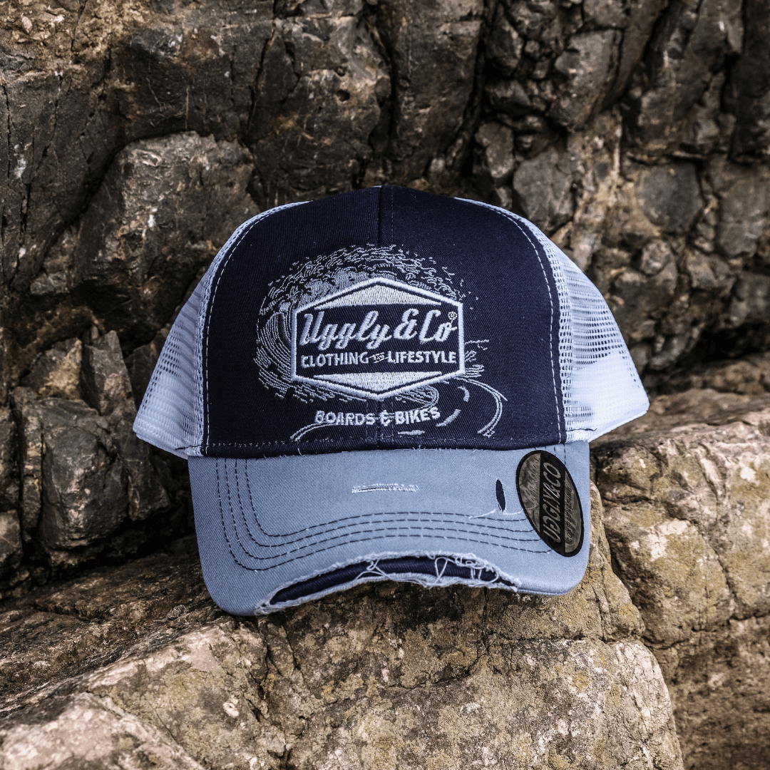 Blue surf diamond trucker hat by Uggly and Co featuring a stylish mesh backing and a vibrant diamond design.