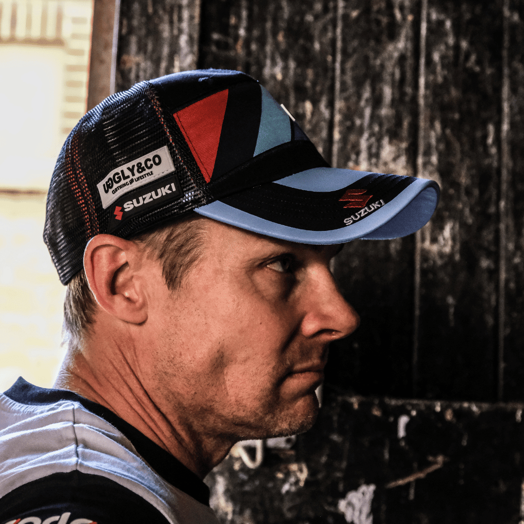 Uggly and Co Team Classic Suzuki Trucker Hat with mesh back and embroidered logo on front, stylish casual headwear.