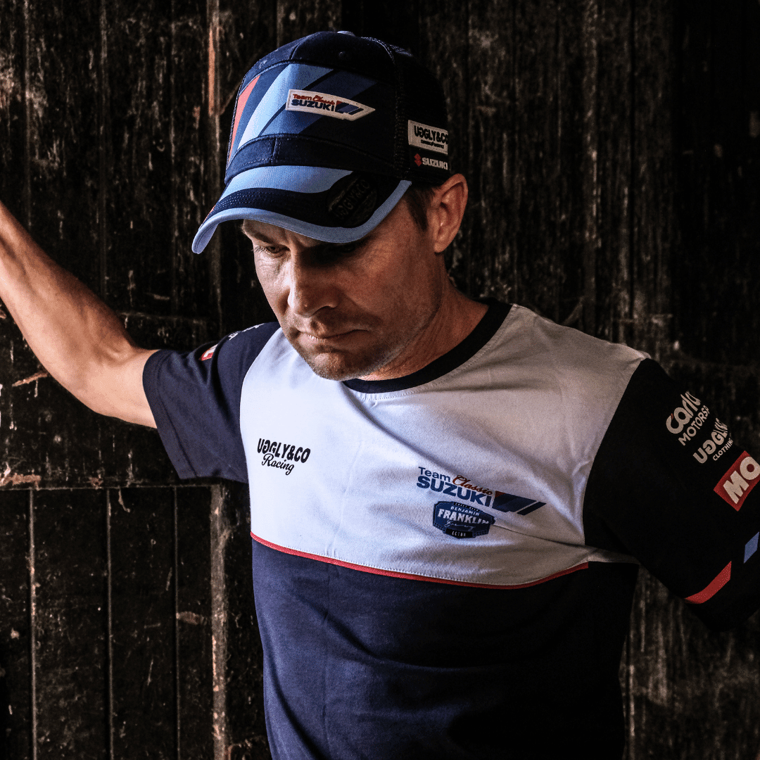 Uggly and Co Team Classic Suzuki Trucker Cap featuring a curved brim, mesh back, and Suzuki motorcycle logo embroidery.